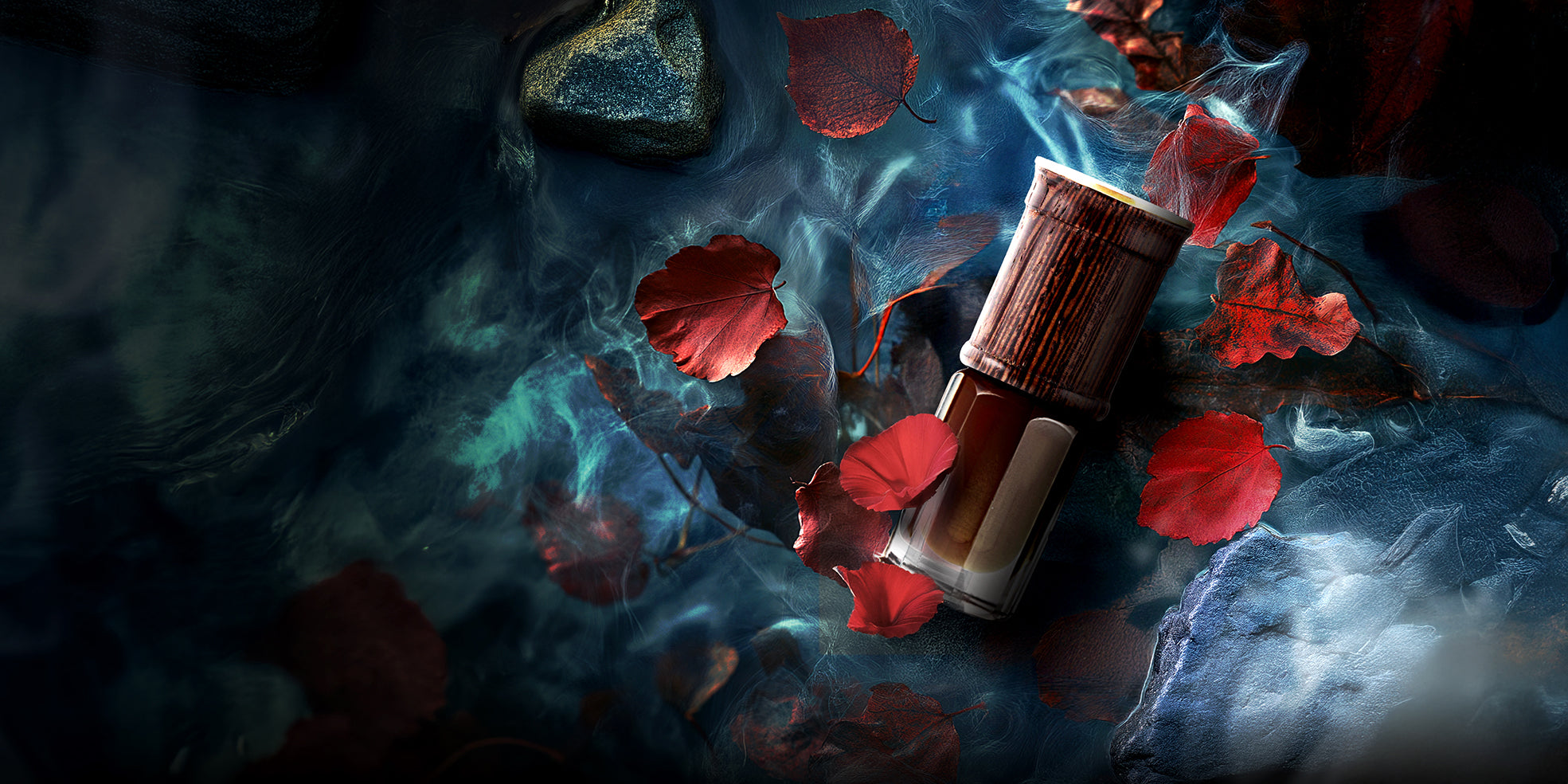 Luxury oud perfume bottle with wooden cap surrounded by red rose petals and blue smoke – SULAYM artisanal fragrance photography.
